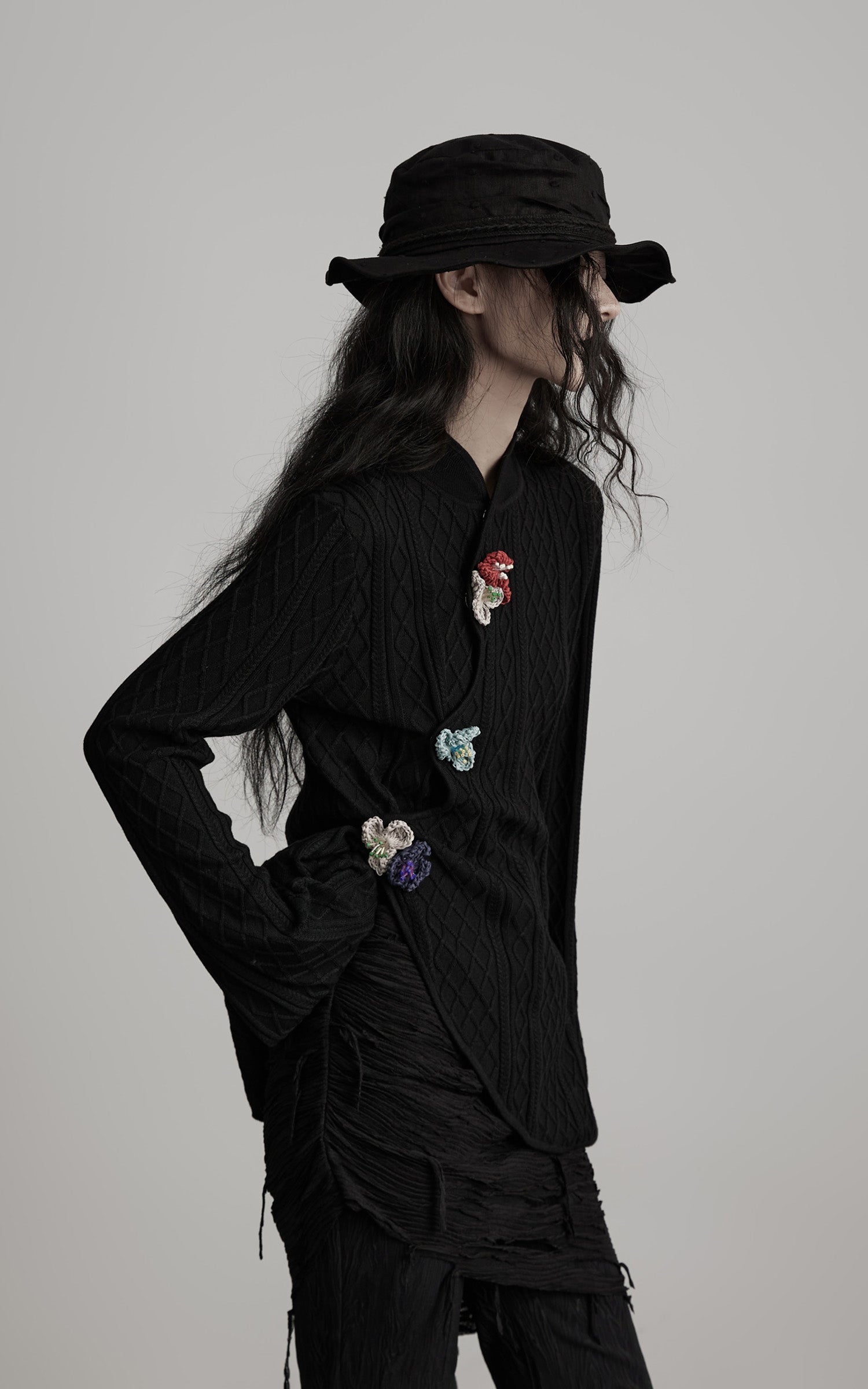 DOINDULGE Diamond Knit Asymmetric Top with Crochet Floral Details