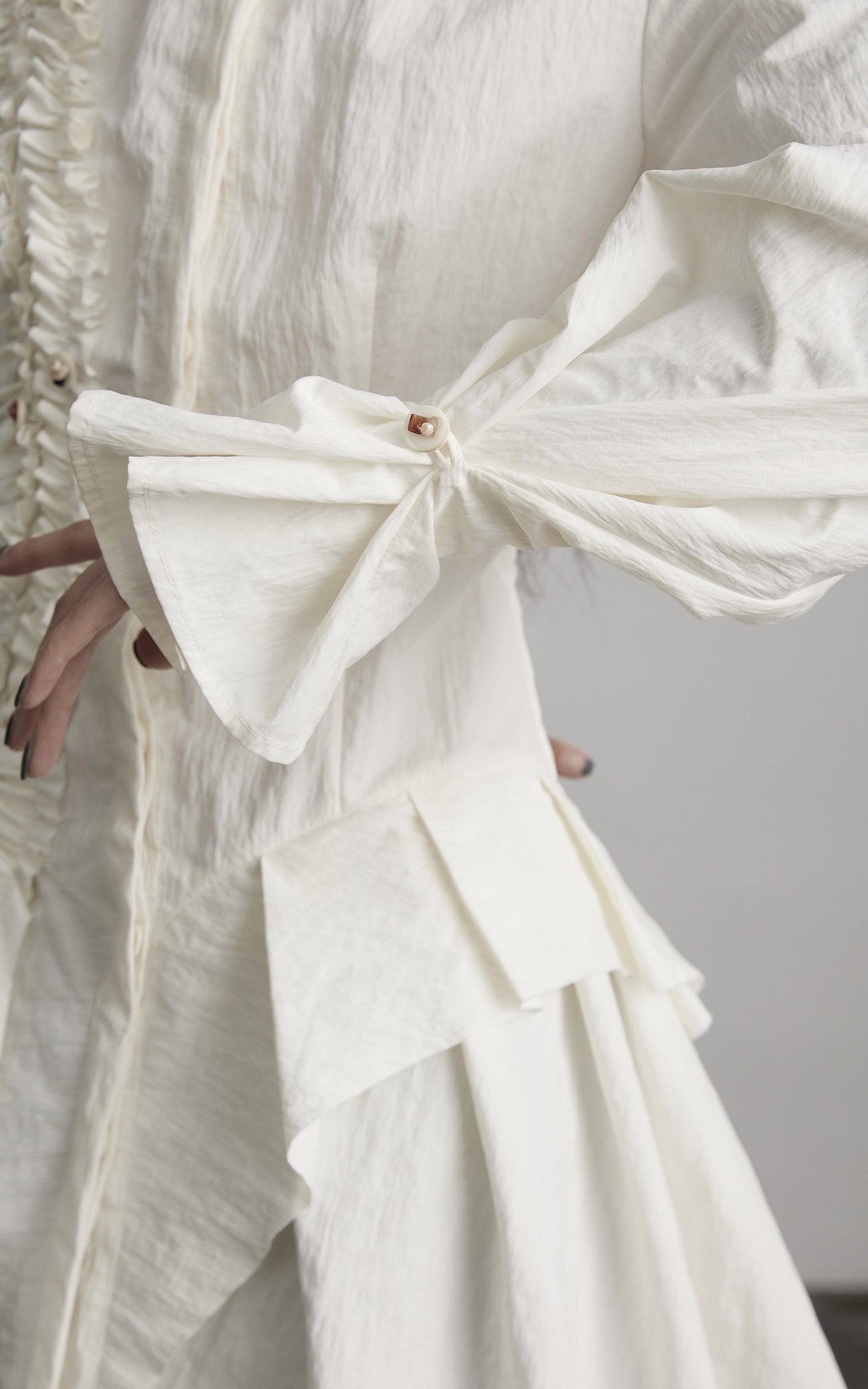 DOINDULGE Asymmetric Ruched High-Neck Shirt with Sculptural Draped Panels