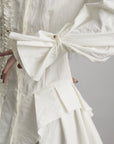 DOINDULGE Asymmetric Ruched High-Neck Shirt with Sculptural Draped Panels