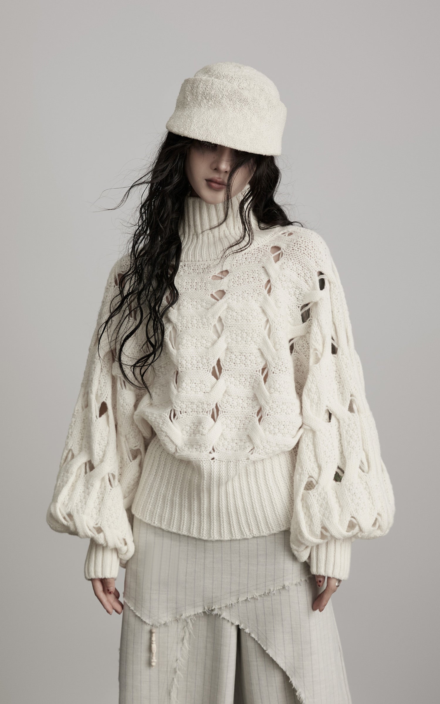 DOINDULGE Braided Void Turtleneck Sweater