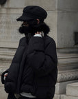 Veste matelassée courte noire avec col en fausse fourrure