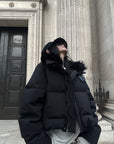 Veste matelassée courte noire avec col en fausse fourrure