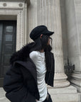 Veste matelassée courte noire avec col en fausse fourrure