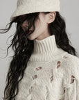 DOINDULGE Braided Void Turtleneck Sweater