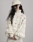 DOINDULGE Braided Void Turtleneck Sweater