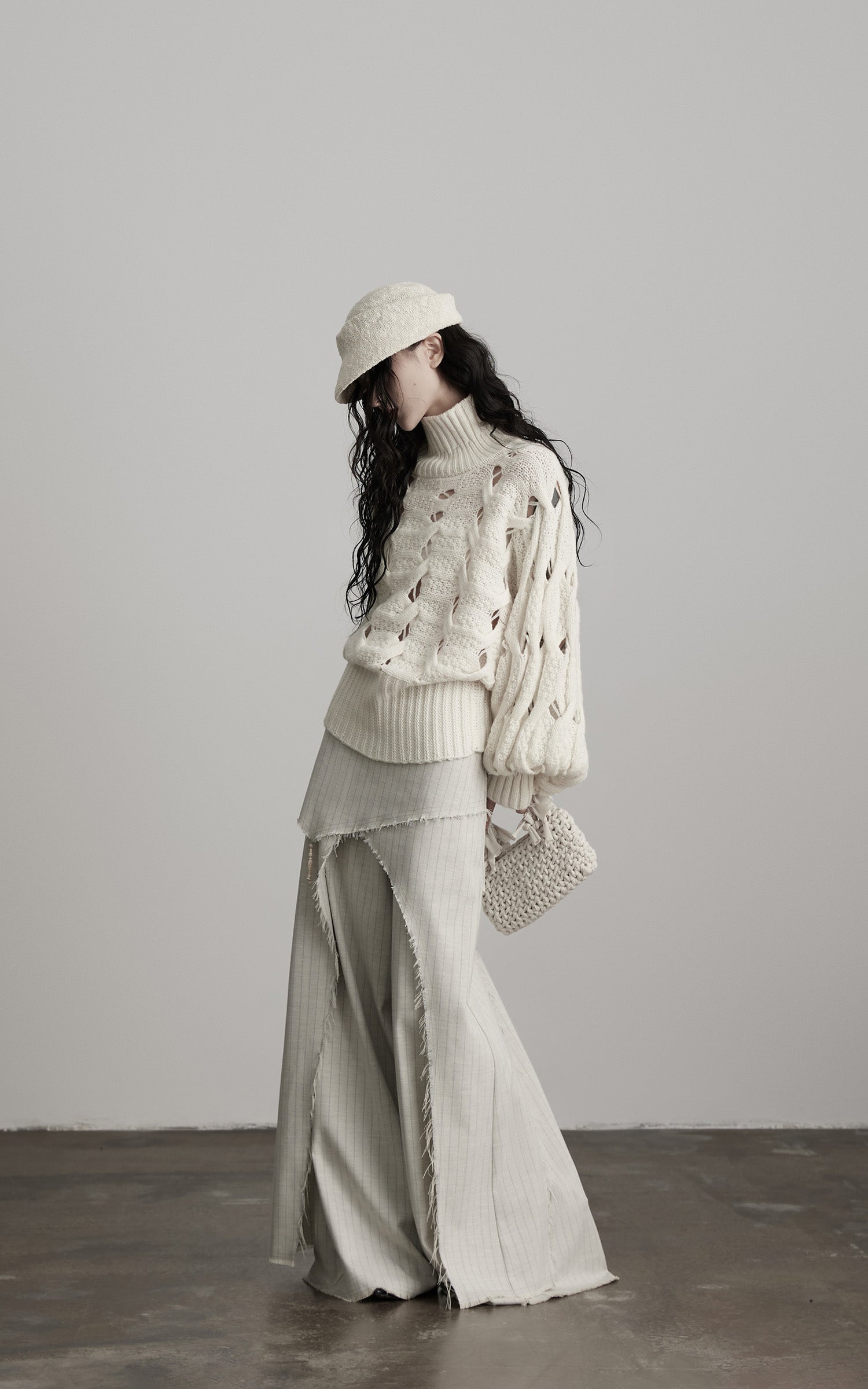 DOINDULGE Braided Void Turtleneck Sweater