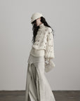 DOINDULGE Braided Void Turtleneck Sweater