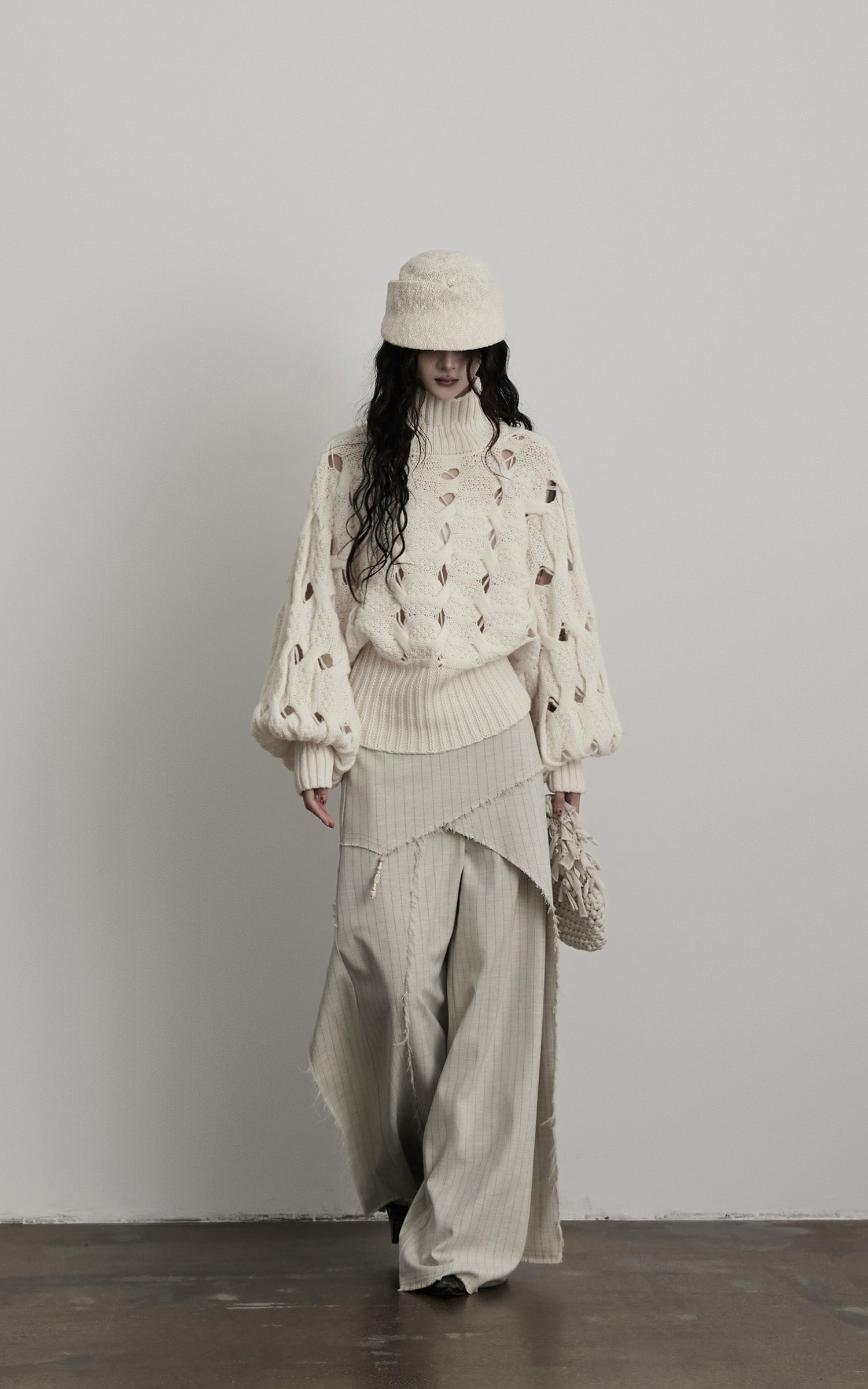 DOINDULGE Braided Void Turtleneck Sweater