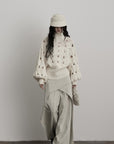 DOINDULGE Braided Void Turtleneck Sweater