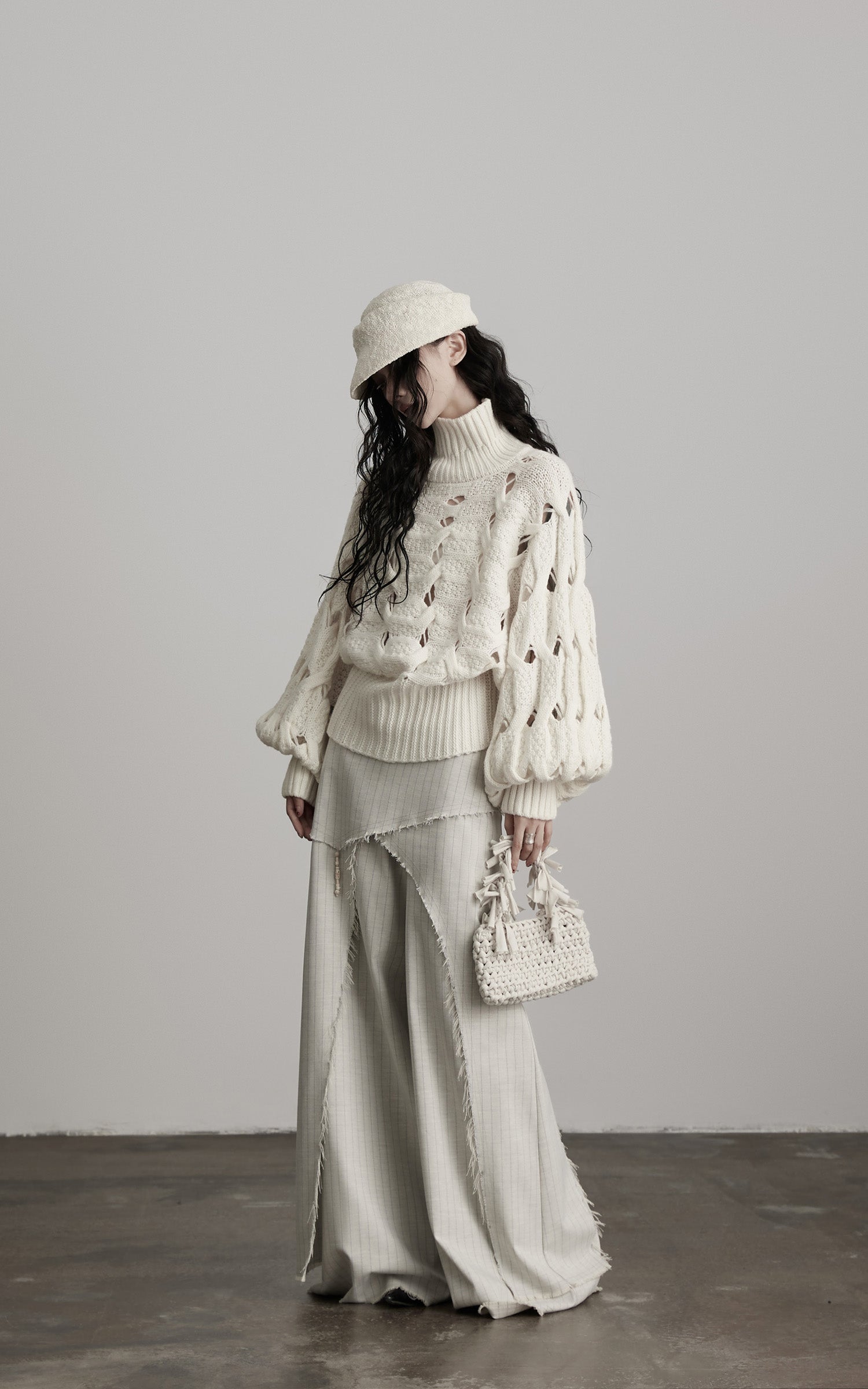 DOINDULGE Braided Void Turtleneck Sweater
