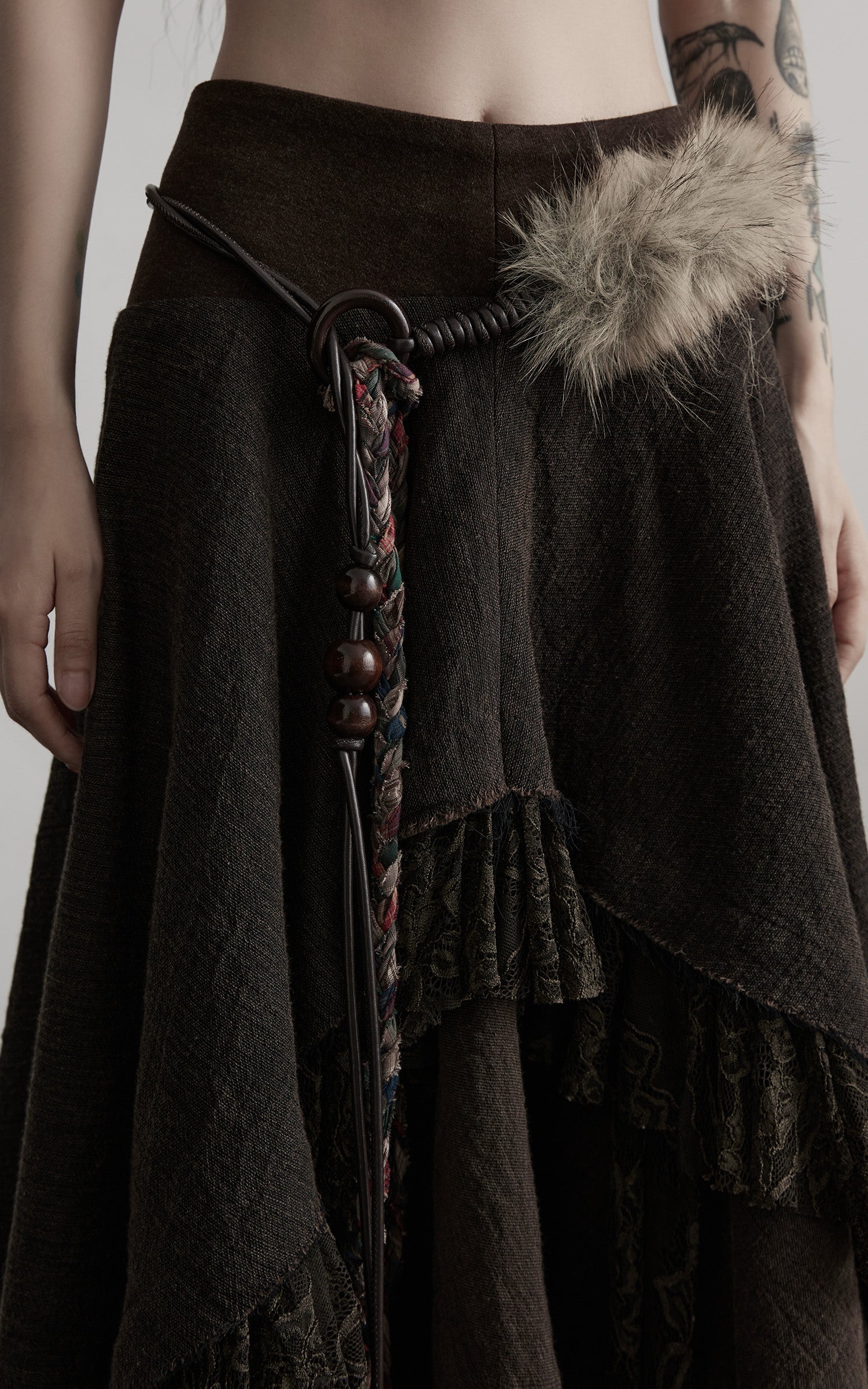 DOINDULGE Layered Asymmetric Skirt with Braided Belt and Fur Accent