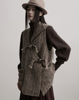 DOINDULGE Textured Wool Vest with Asymmetric Panels and Hand-Tied Toggle Details