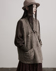 DOINDULGE Textured Wool Vest with Asymmetric Panels and Hand-Tied Toggle Details