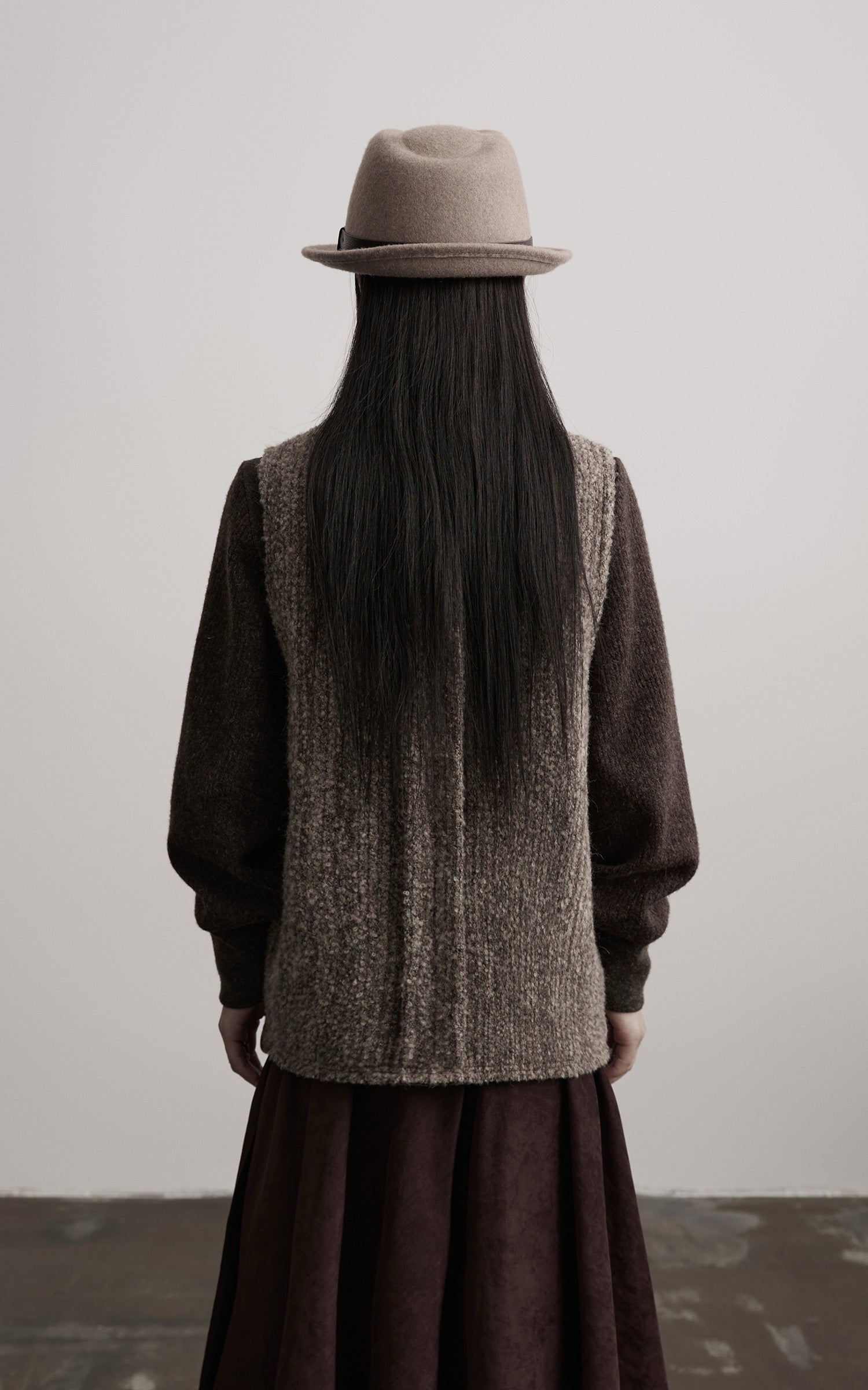DOINDULGE Textured Wool Vest with Asymmetric Panels and Hand-Tied Toggle Details