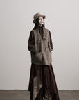DOINDULGE Textured Wool Vest with Asymmetric Panels and Hand-Tied Toggle Details
