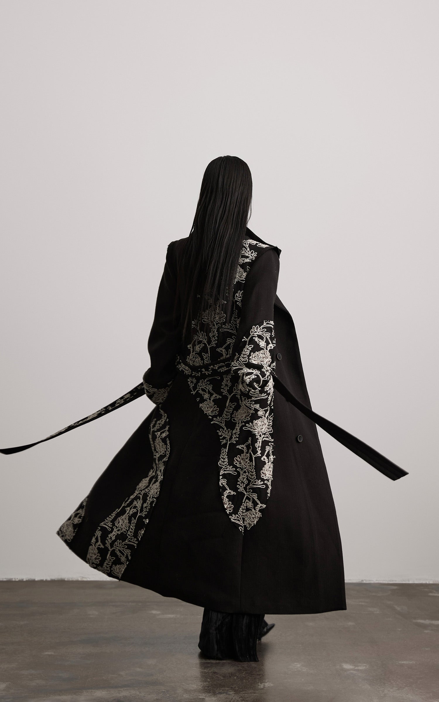 DOINDULGE Embroidered Asymmetric Long Coat