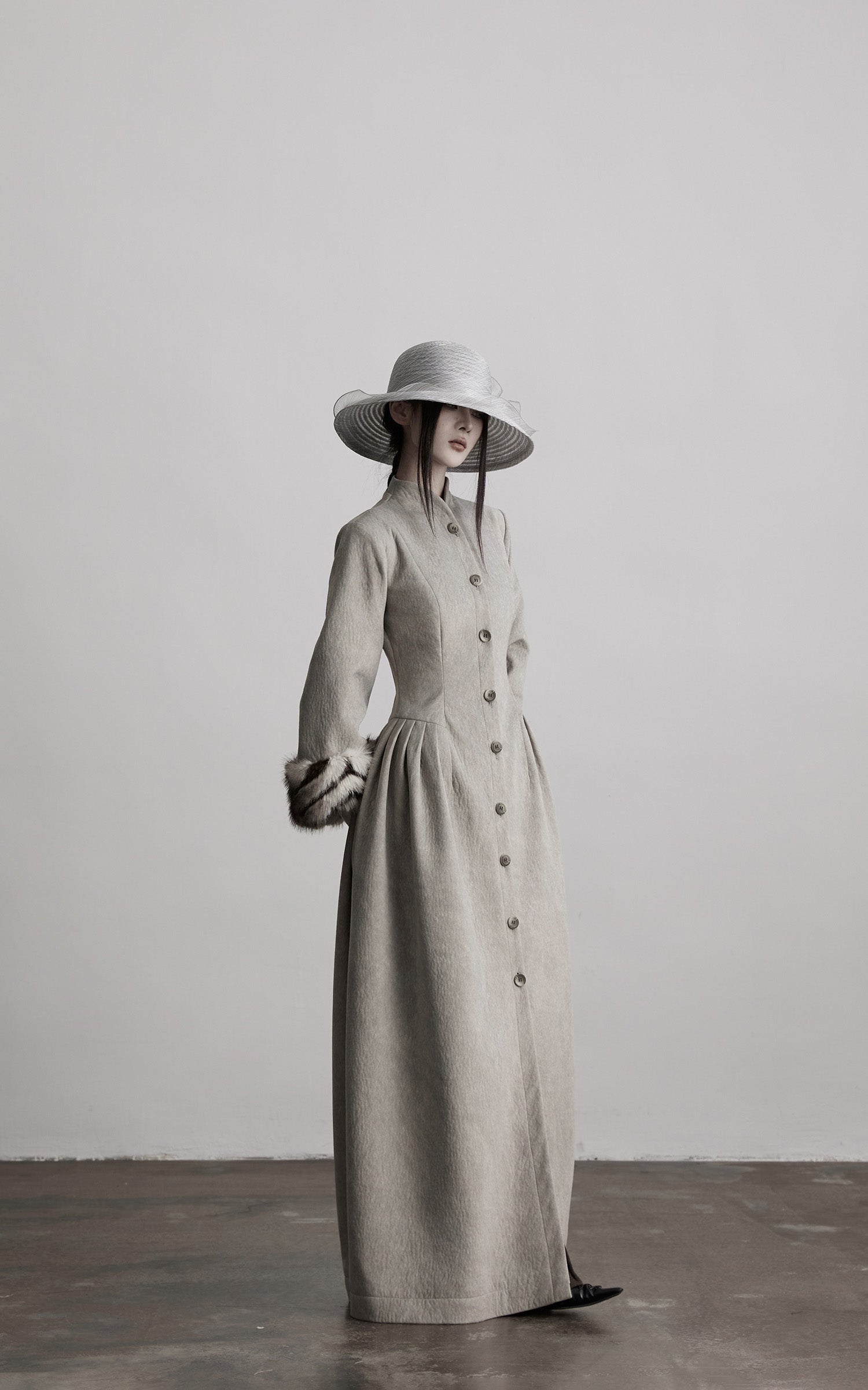 DOINDULGE Sculptural Long Coat with Faux-Fur Cuffs