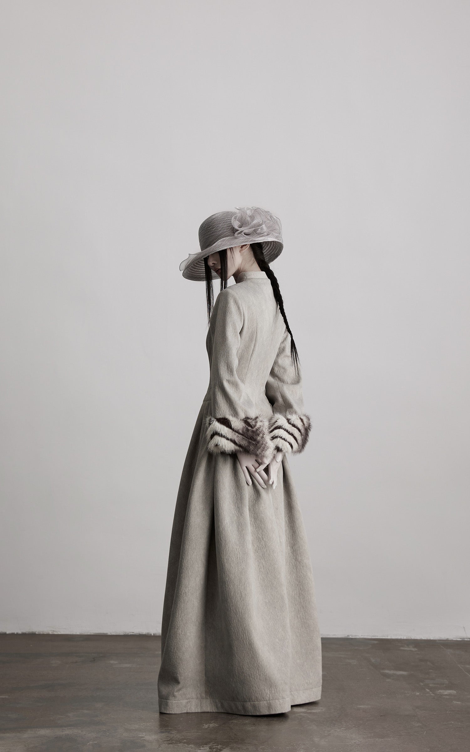DOINDULGE Sculptural Long Coat with Faux-Fur Cuffs