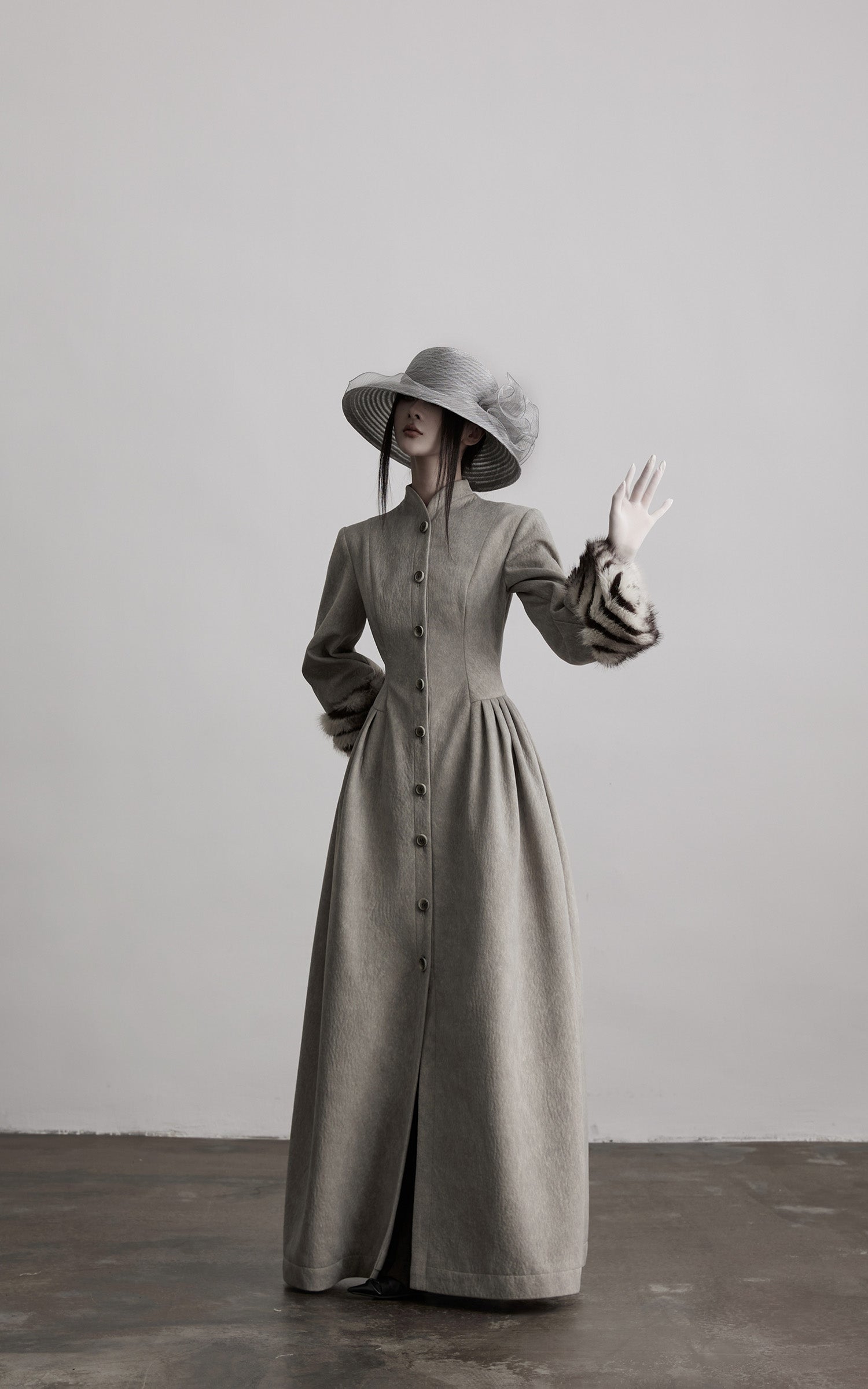 DOINDULGE Sculptural Long Coat with Faux-Fur Cuffs