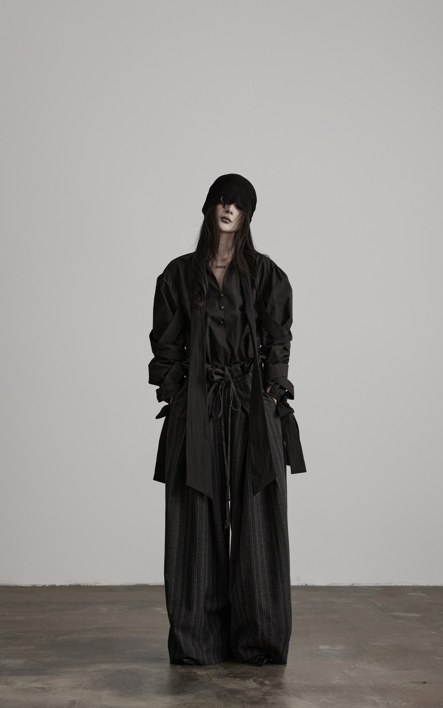 DOINDULGE Sculptural Ribbon Sleeve High Neck Shirt