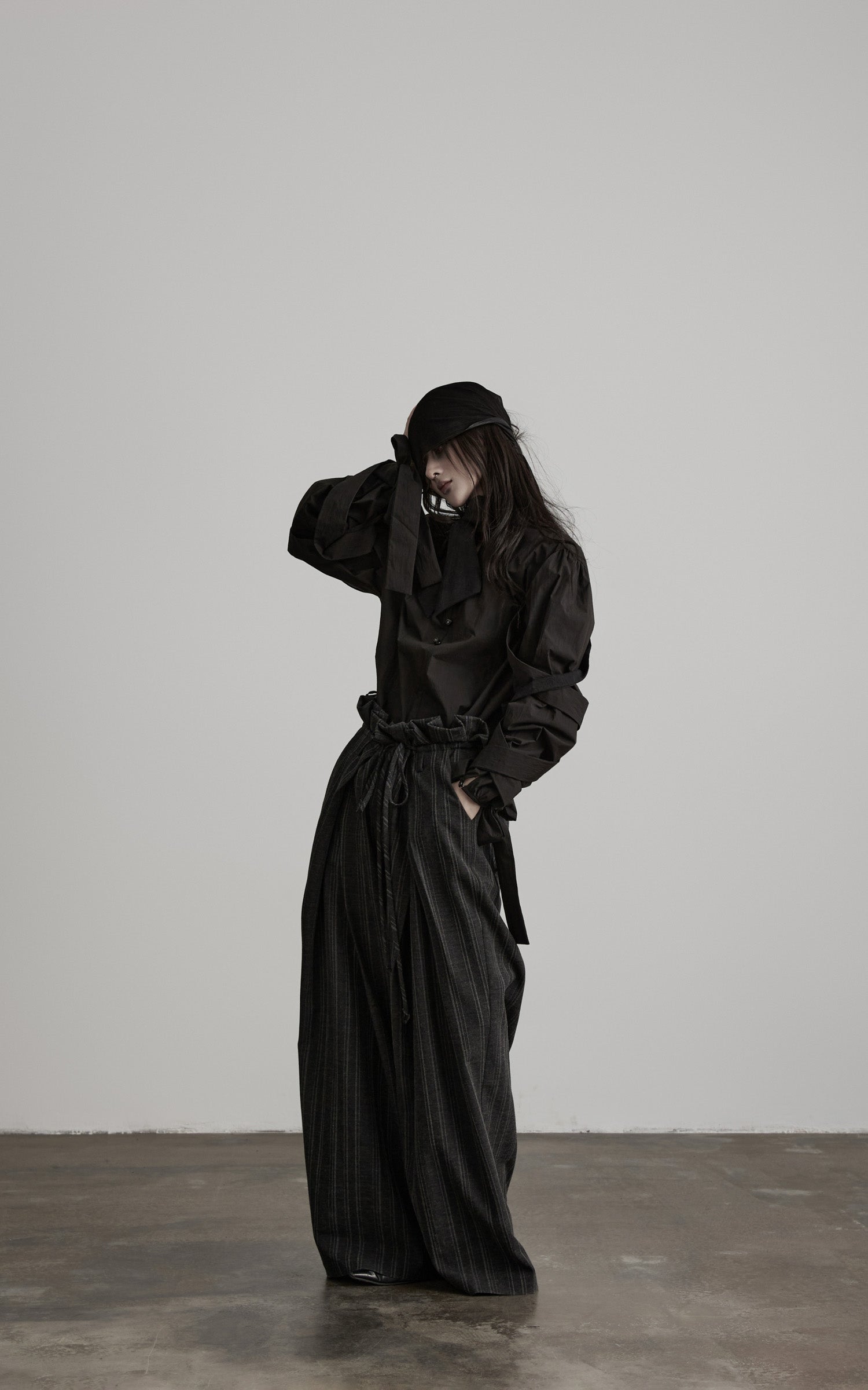 DOINDULGE Sculptural Ribbon Sleeve High Neck Shirt