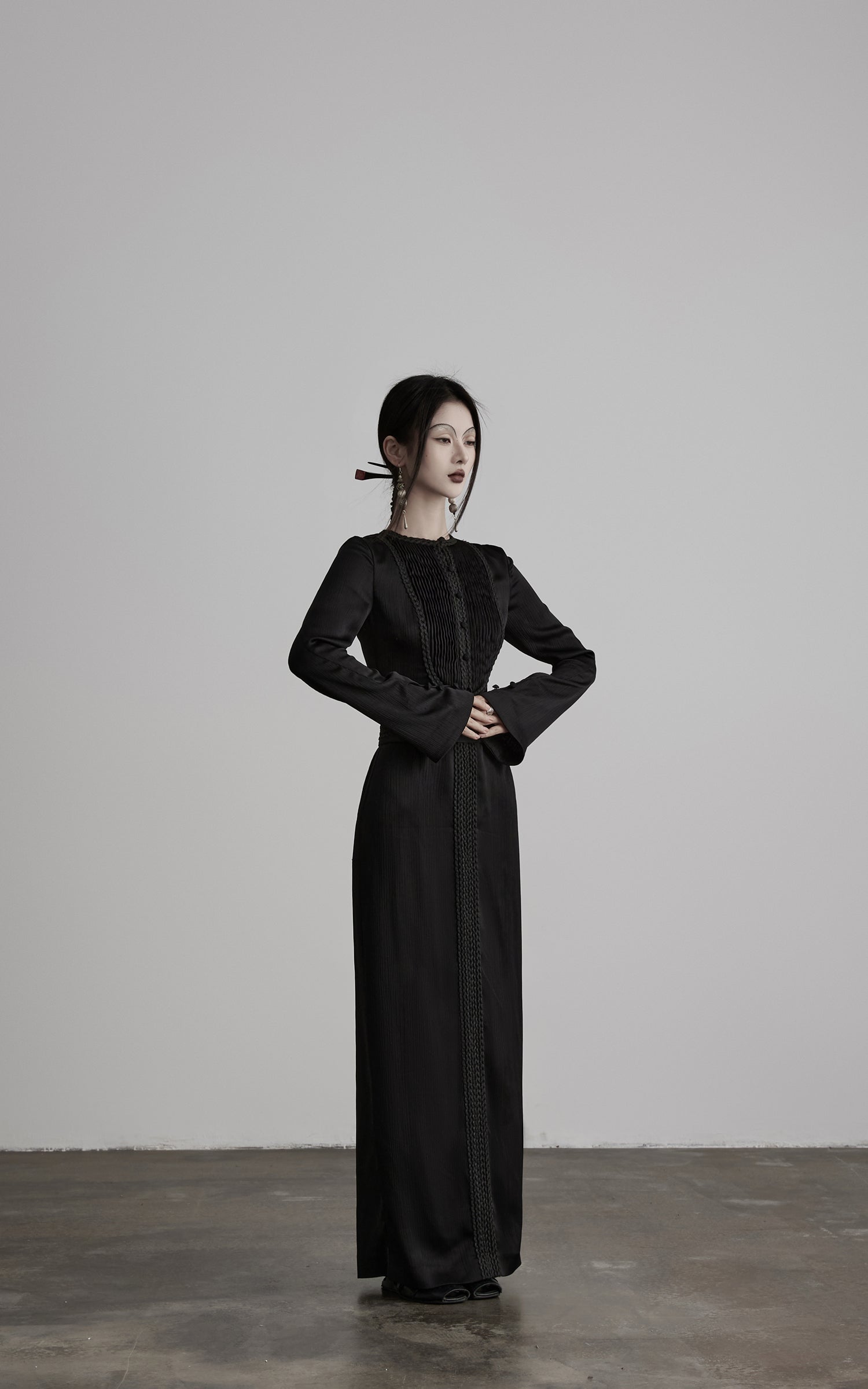 DOINDULGE Pleated Panel Braided Waist Long Sleeve Sculptural Maxi Dress