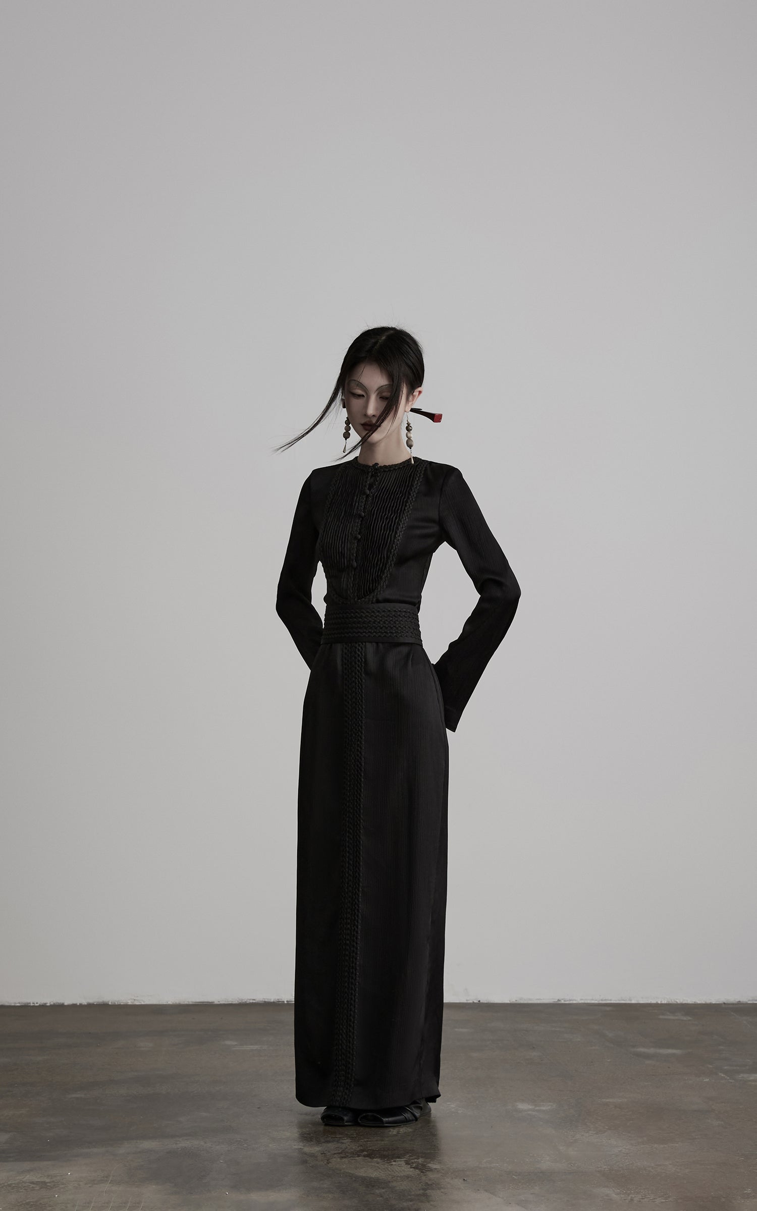 DOINDULGE Pleated Panel Braided Waist Long Sleeve Sculptural Maxi Dress