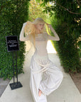 RASE LE SOL Pantalon large à bretelles drapées