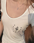 Rase le sol Star Emblem Ruched Scoop Neck Top