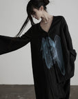 DOINDULGE Asymmetric V-Neck Printed Shirt