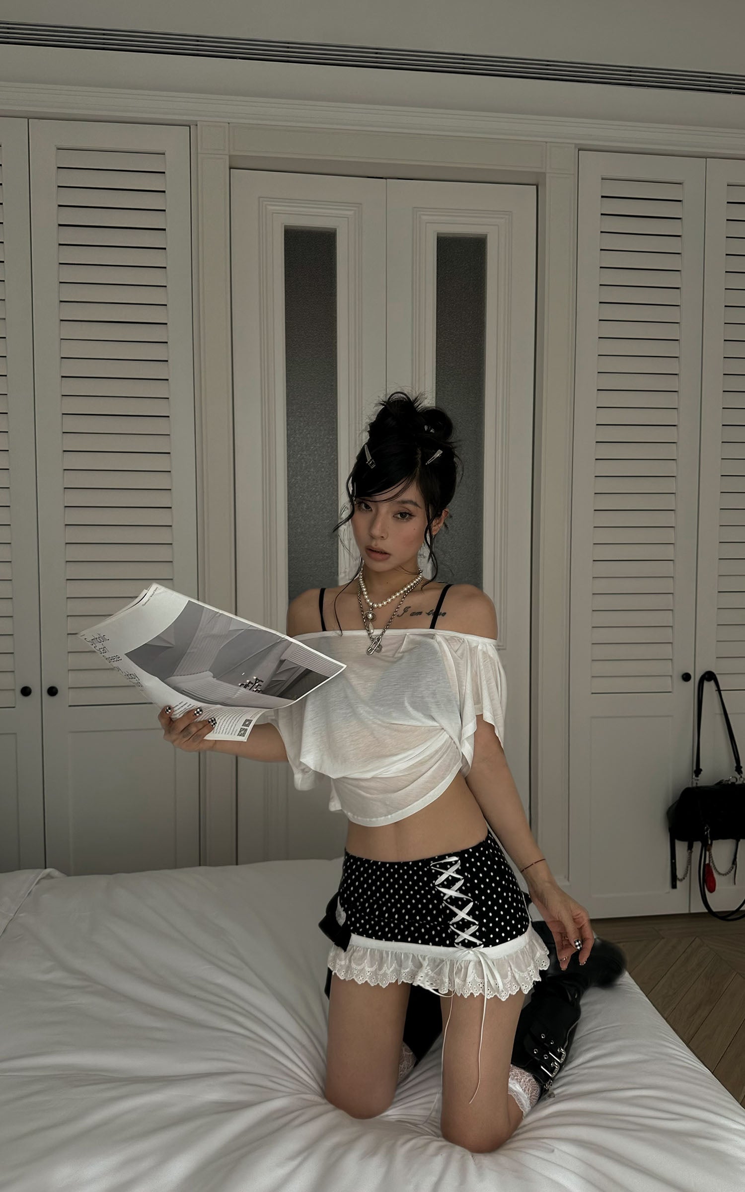 WARDEN EDGE Polka Dot Lace Up Mini Skirt with Ruffled Hem and Asymmetric Layered Detail