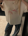 Rase le sol Amor Fati Off-Shoulder Oversized T-Shirt