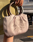 Hydrae Rhinestone Rose Satin Mini Handbag with Sculptural Wooden Ring Handles