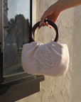 Hydrae Rhinestone Rose Satin Mini Handbag with Sculptural Wooden Ring Handles