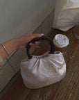 Hydrae Rhinestone Rose Satin Mini Handbag with Sculptural Wooden Ring Handles