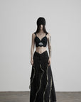 DOINDULGE Low-Rise Frayed Denim Maxi Skirt