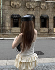Rase le sol Cream Layered Ruffle Bubble Mini Skirt With Cross-Wing Appliqué