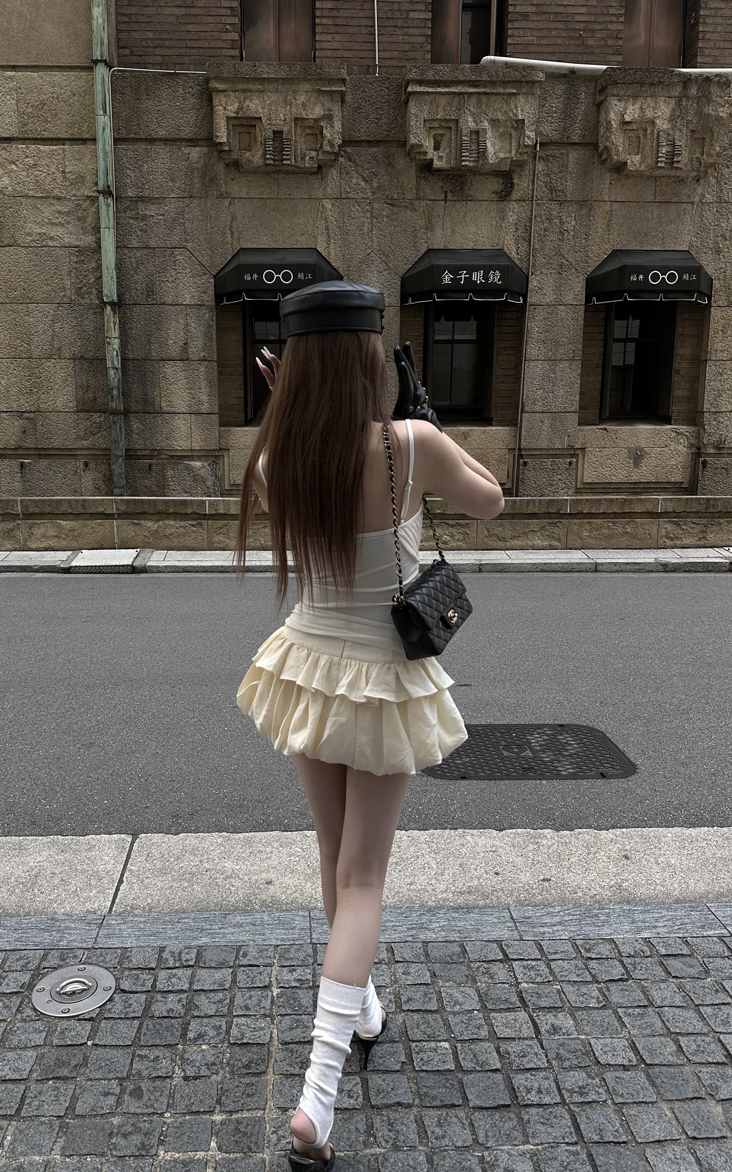 Rase le sol Cream Layered Ruffle Bubble Mini Skirt With Cross-Wing Appliqué