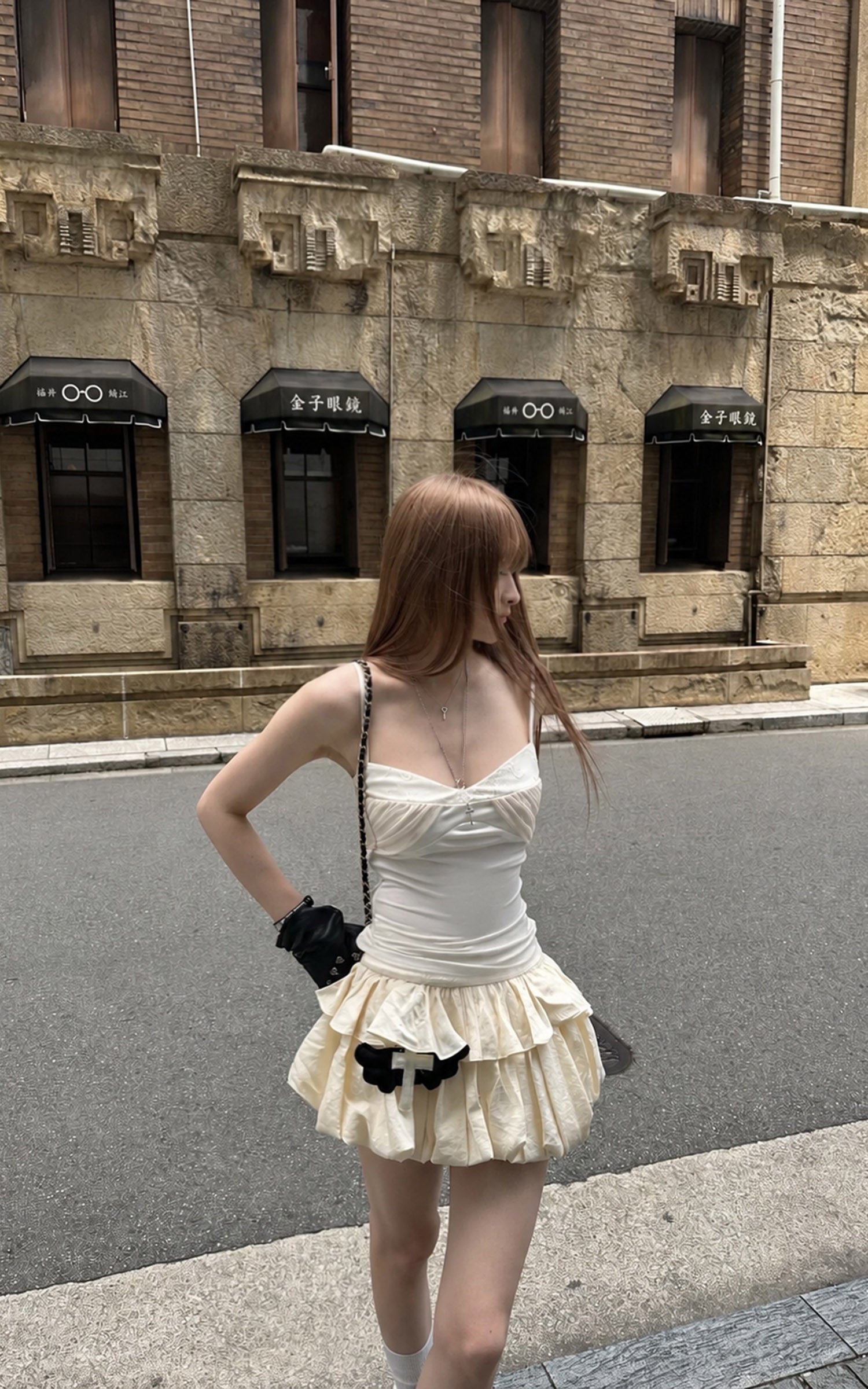 Rase le sol Cream Layered Ruffle Bubble Mini Skirt With Cross-Wing Appliqué