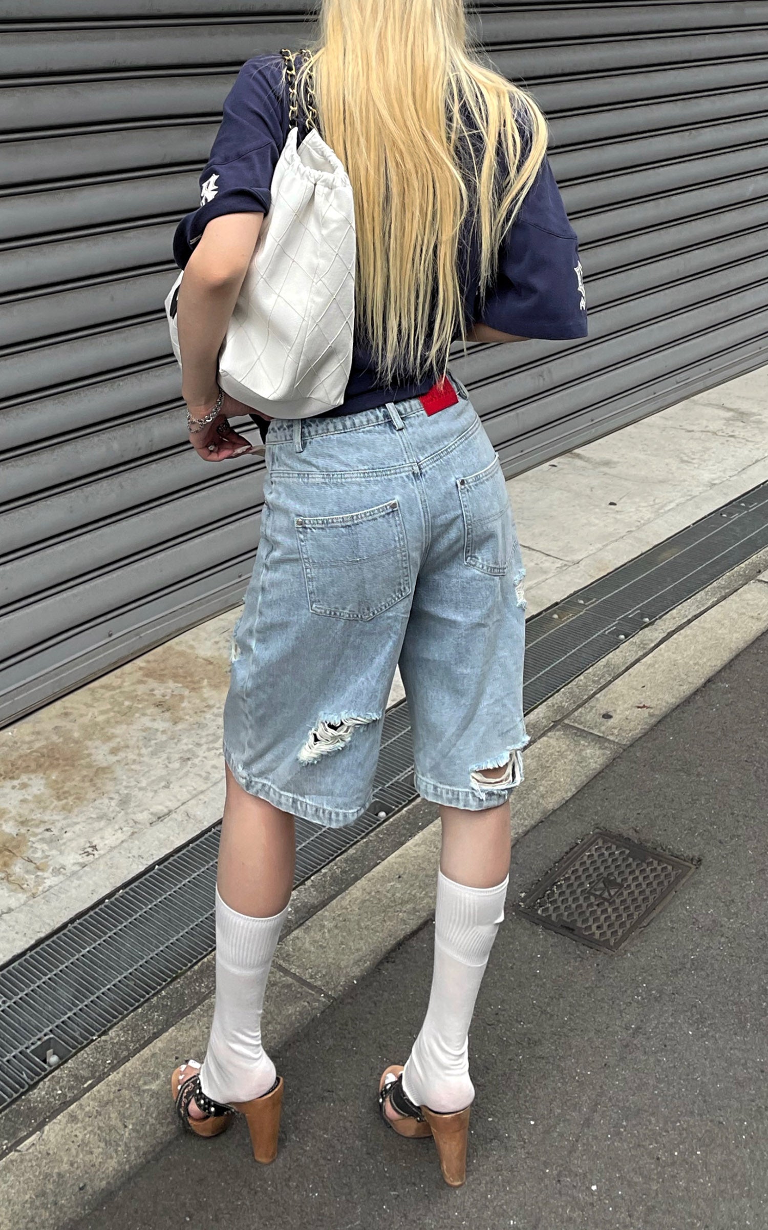 Rase le sol Low-Rise Asymmetric Waist Distressed Denim Pants