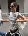 ROVENTE Vintage Grey Fitted Baby Tee with Statement Graphic