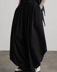 DOINDULGE Asymmetric Textured Wide-Leg Palazzo Pants