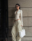 ROVENTE Draped Plunge Corset Long Sleeve Top