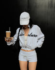 ROVENTE Cropped Zip Jacket and Mini Shorts Set with Embroidered Script Detail and Relaxed Sporty Silhouette