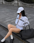 ROVENTE Cropped Zip Jacket and Mini Shorts Set with Embroidered Script Detail and Relaxed Sporty Silhouette