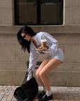 ROVENTE Cropped Zip Jacket and Mini Shorts Set with Embroidered Script Detail and Relaxed Sporty Silhouette