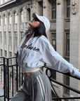 ROVENTE Cropped Zip Jacket and Mini Shorts Set with Embroidered Script Detail and Relaxed Sporty Silhouette