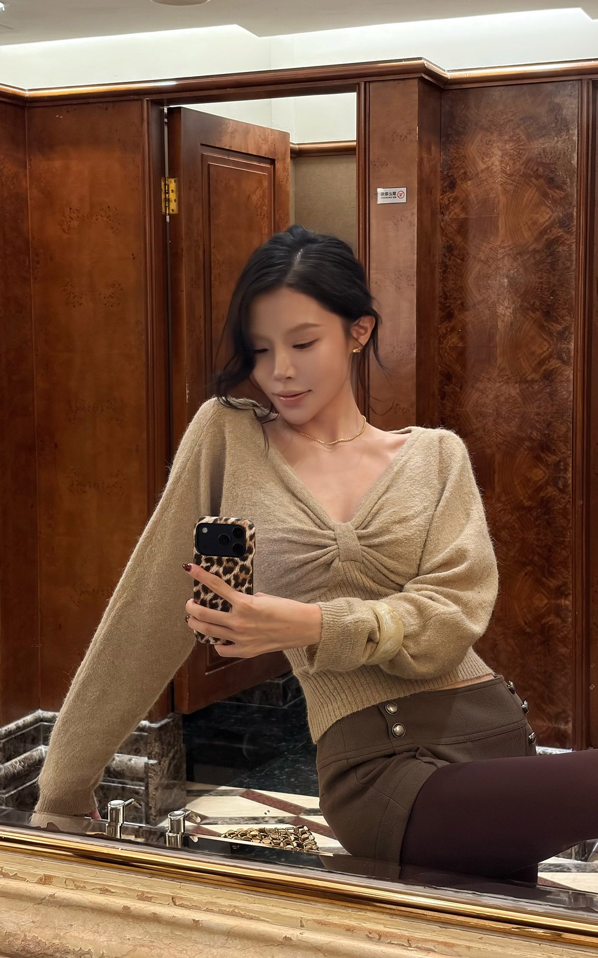 Hydrae Twist-Front Deep V-Neck Knit Top
