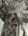 DOINDULGE Engraved Botanical Wrap Maxi Dress