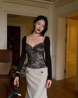 Hydrae Jupe midi ajustée taille basse à boutons